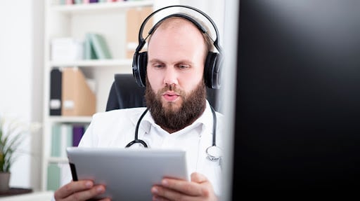 healthcare professional listening to healthcare podcast 