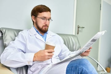 healthcare marketer reading reliable news source