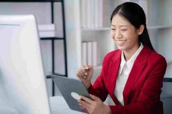 healthcare marketer writing on tablet