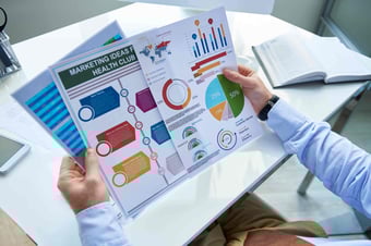  Marketer looking at colorful graphics 