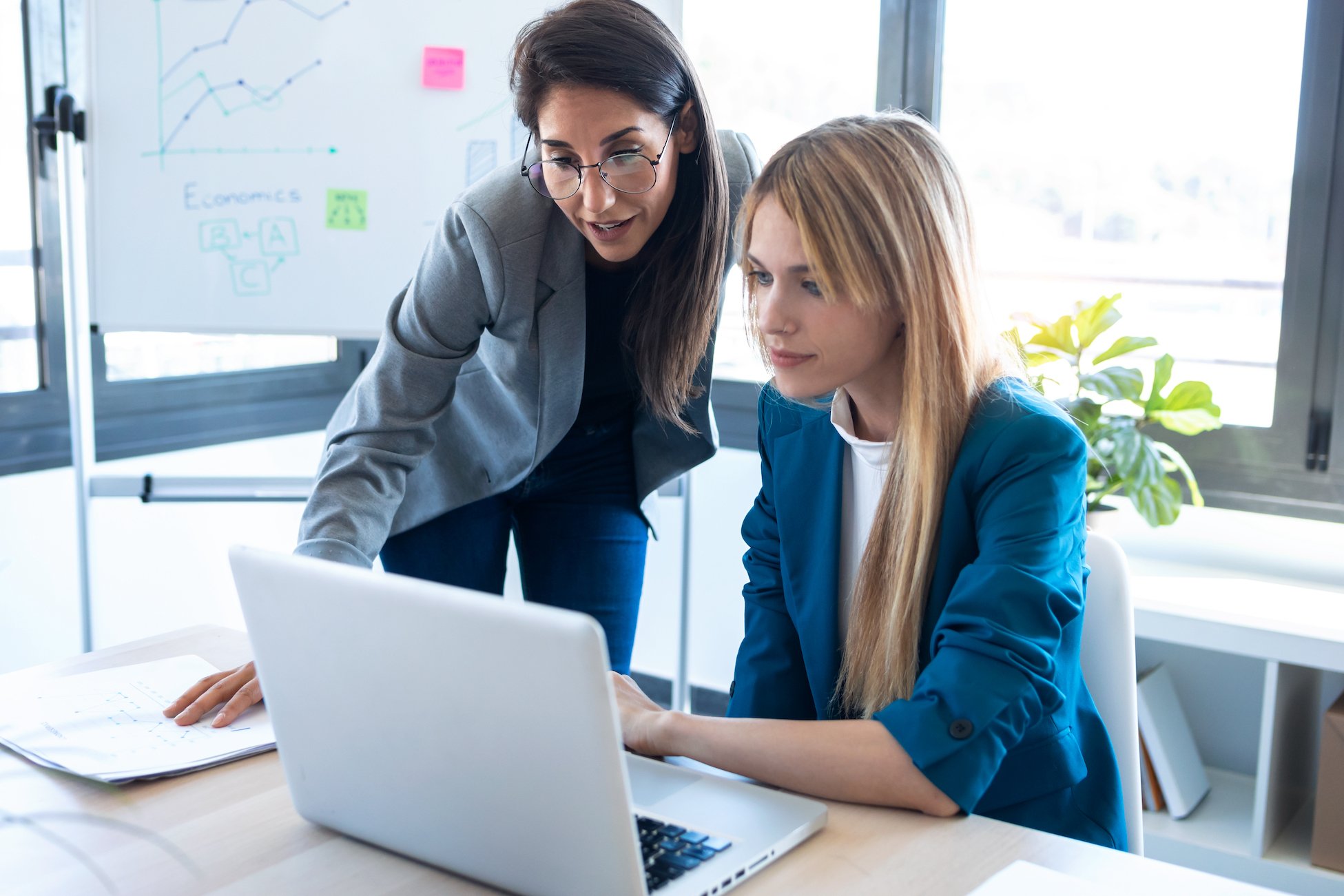 two-business-women-working-together-with-laptop-in-2021-08-28-20-06-52-utc (1)-1