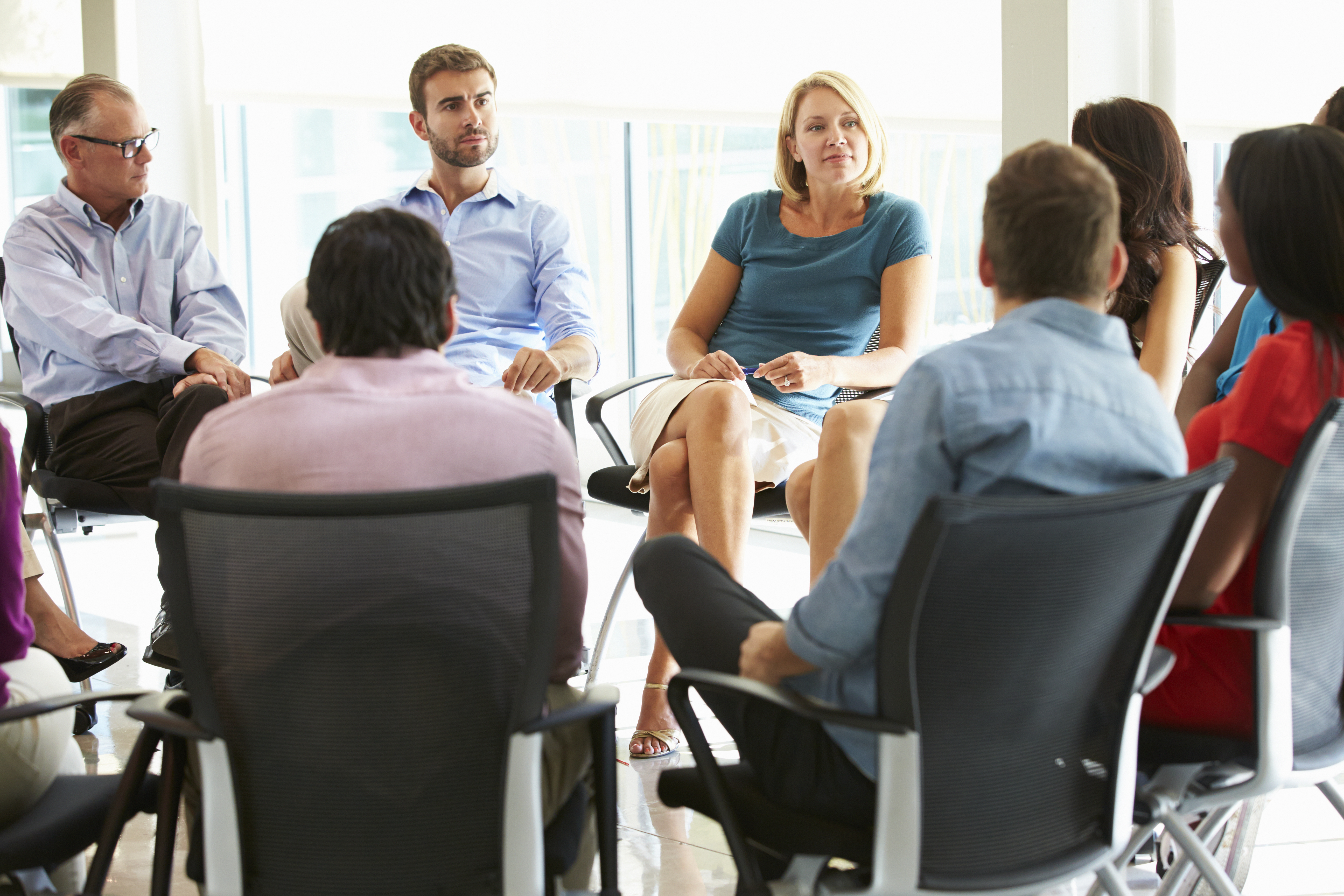 multi-cultural-office-staff-sitting-having-meeting-2021-08-26-16-12-45-utc