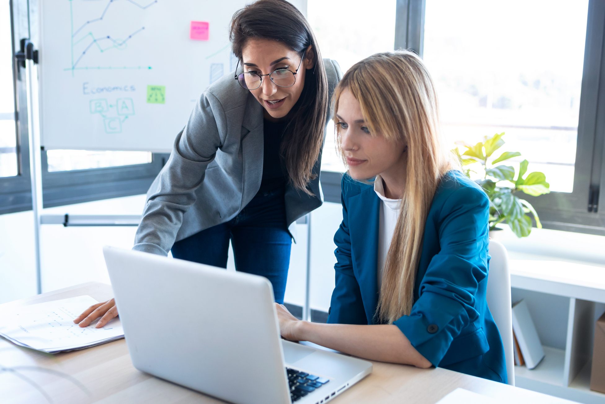 two-business-women-working-together-with-laptop-in-2021-08-28-20-06-52-utc (1)