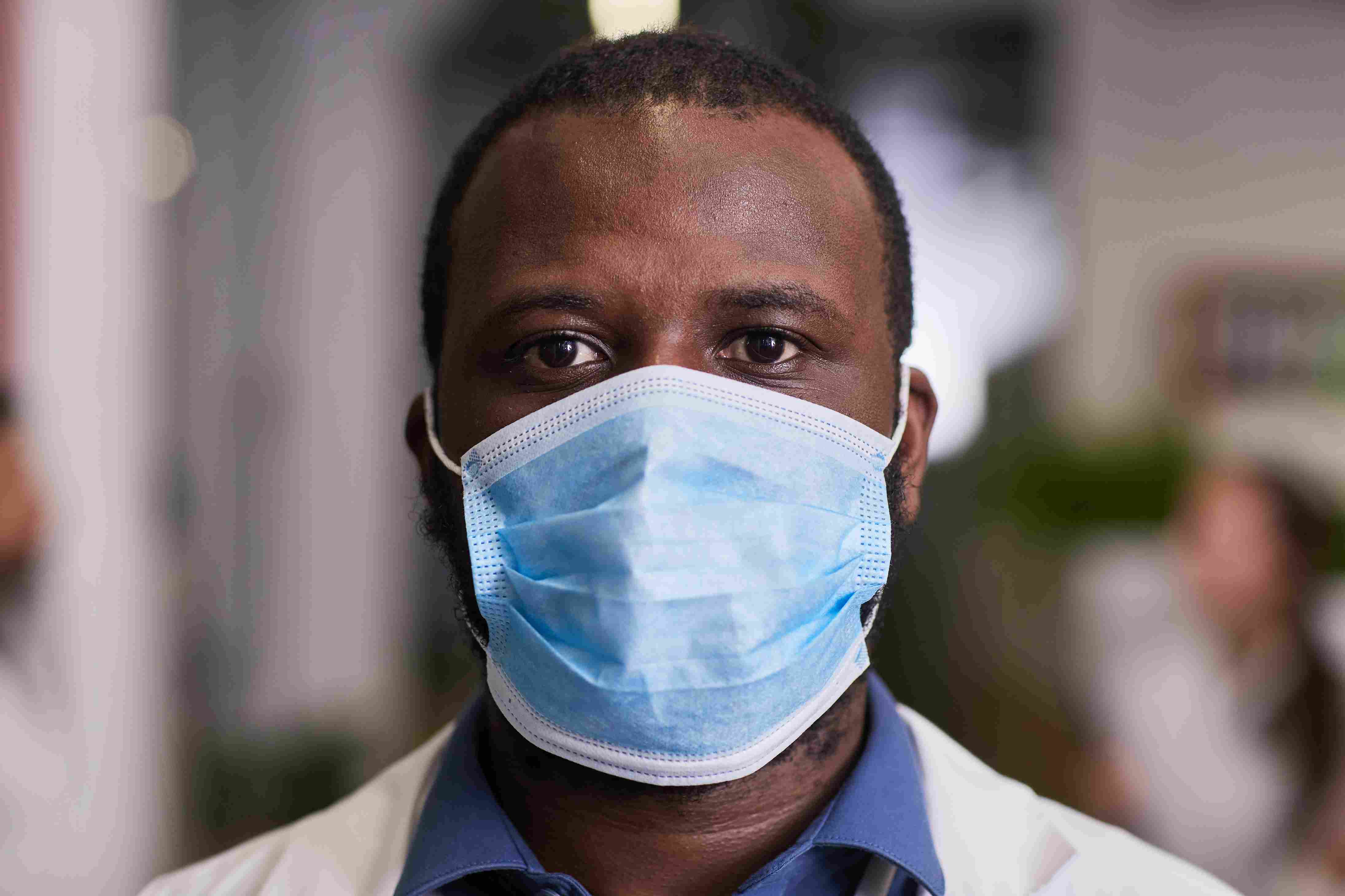Serious healthcare worker looking straight into camera